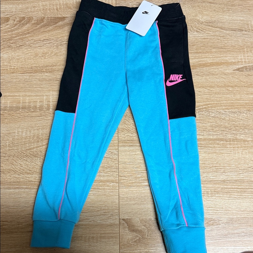 Nike Kids Turquoise and Black Joggers with Pink Accents